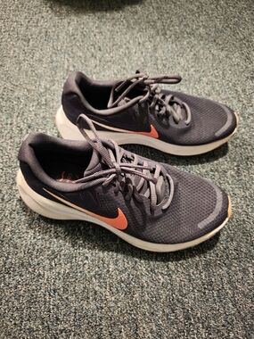 Nike Revolution Dark Blue Running Sneakers with Orange Swoosh